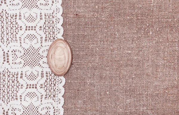 Vintage background with lace on the burlap — Stock Photo, Image