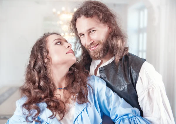 Beautiful couple woman and man in medieval clothes — Stock Photo, Image
