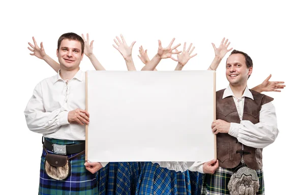 Group of dancers of Scottish dance with empty banner — Stock Photo, Image