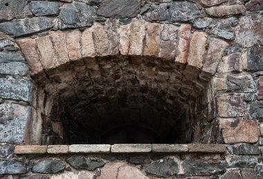 Taş mazgal arka plan ile Ortaçağ doku duvar