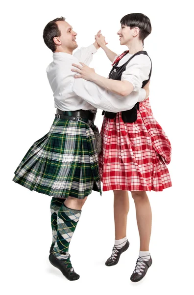 Женщина и мужчина танцуют шотландский танец — стоковое фото