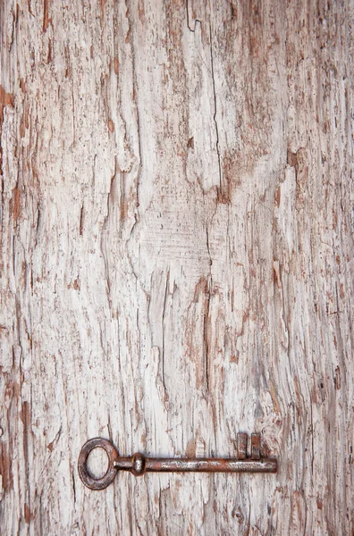 Fondo vintage con llave vieja en madera envejecida — Foto de Stock