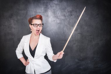 Angry screaming teacher with pointer on blackboard background clipart