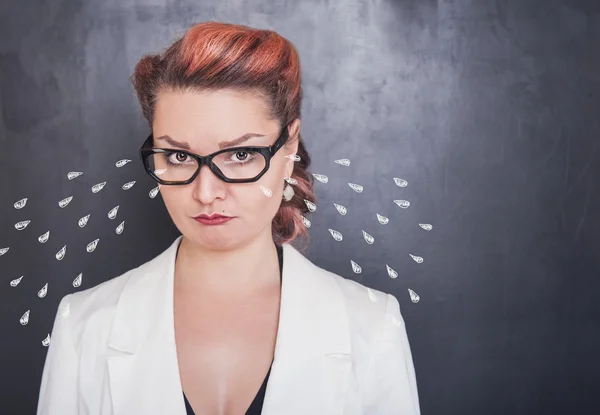 Sad crying woman on blackboard background — Stock Photo, Image