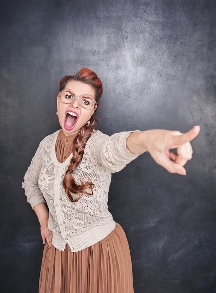 Angry screaming woman pointing out — Stock Photo, Image