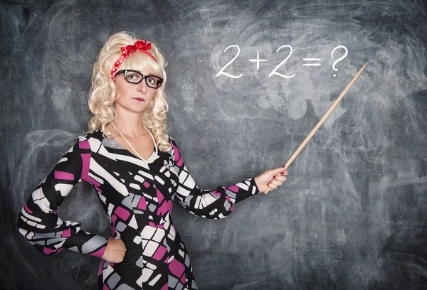 Serious retro teacher in glasses with pointer — Stock Photo, Image