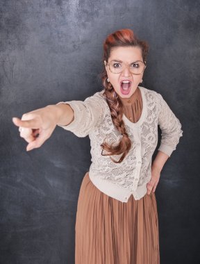 Angry screaming teacher pointing out  clipart