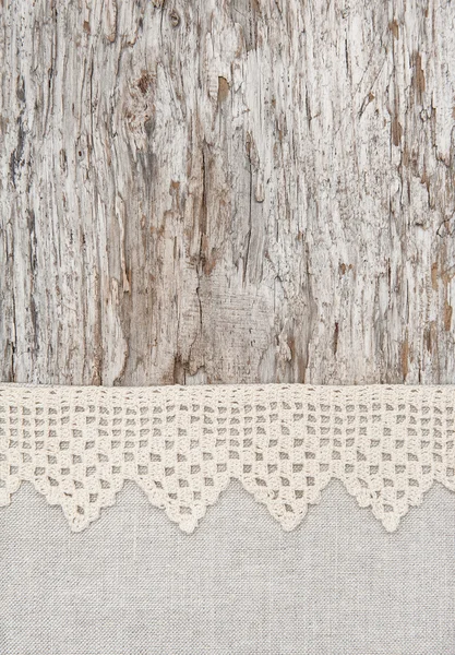 Lace and linen fabric on the old wood — Stock Photo, Image