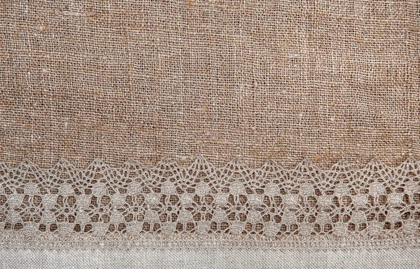 Burlap background with lacy and linen cloth — Stock Photo, Image