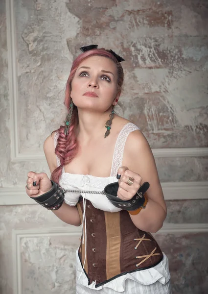 Beautiful steampunk woman with handcuffs — Stock Photo, Image