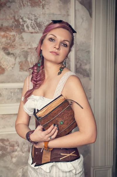 Beautiful steampunk woman with old book — Stock Photo, Image