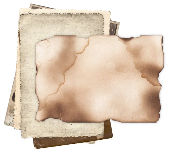 Old paper with burned edges on bunch of vintage photos — Stock Photo, Image