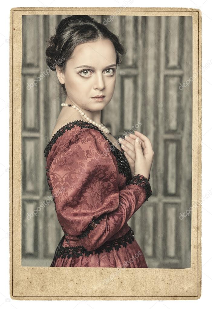 Portrait of beautiful medieval woman in old photo frame