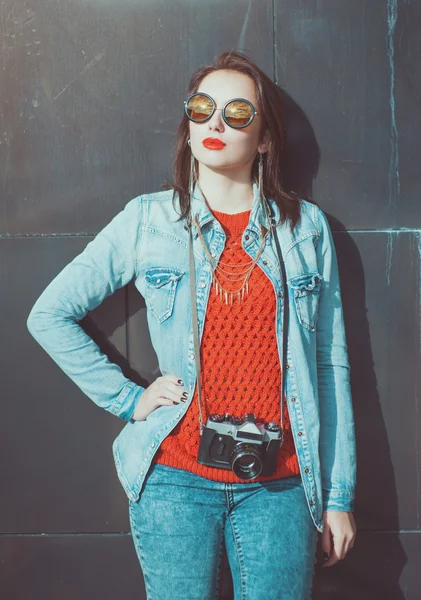 Young beautiful girl in red jersey with sunglasses — Stock Photo, Image