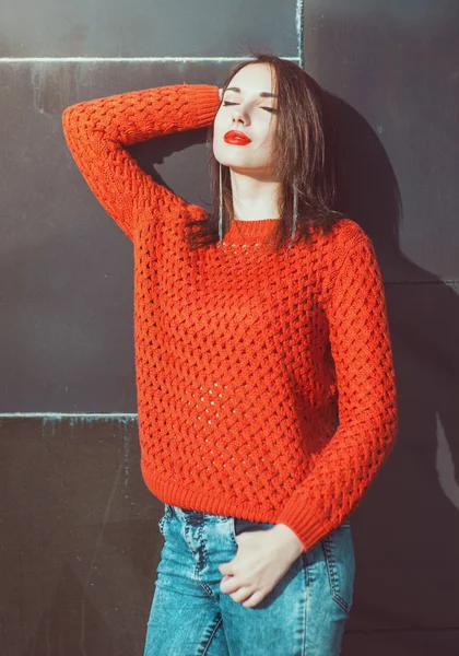 Young beautiful girl in red jersey enjoy sunlight — Stock Photo, Image