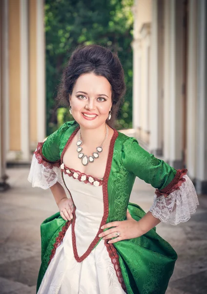 Beautiful woman in green medieval dress — Stock Photo, Image