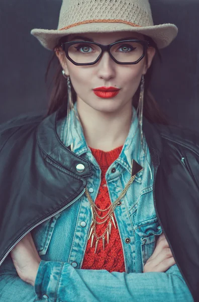 Young beautiful girl in red jersey and hat — Stock Photo, Image