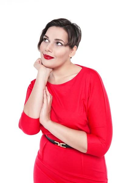 Mulher bonita plus size em vestido vermelho posando isolado — Fotografia de Stock