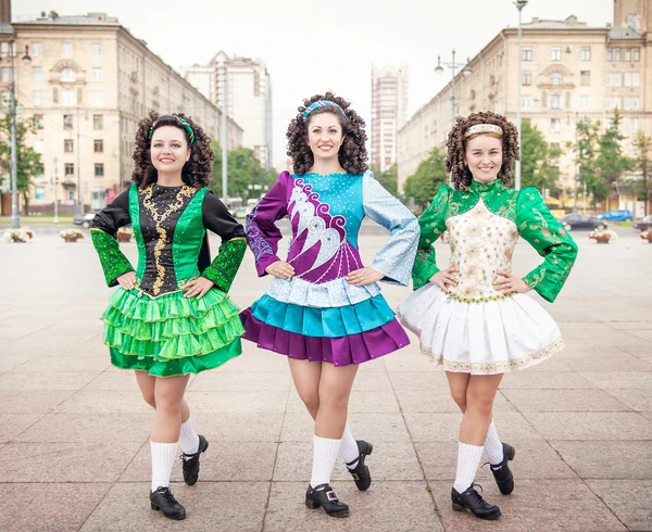 Three women in irish dance dresses posing outdoor — Stock Photo, Image