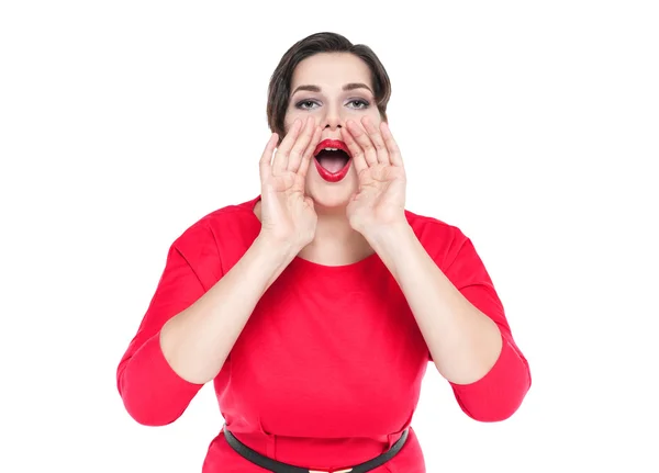 Beautiful plus size woman shouting through megaphone shaped hand — Stock Photo, Image