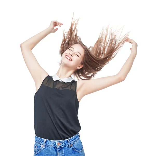 Feliz joven adolescente con las manos arriba y el pelo revoloteando —  Fotos de Stock
