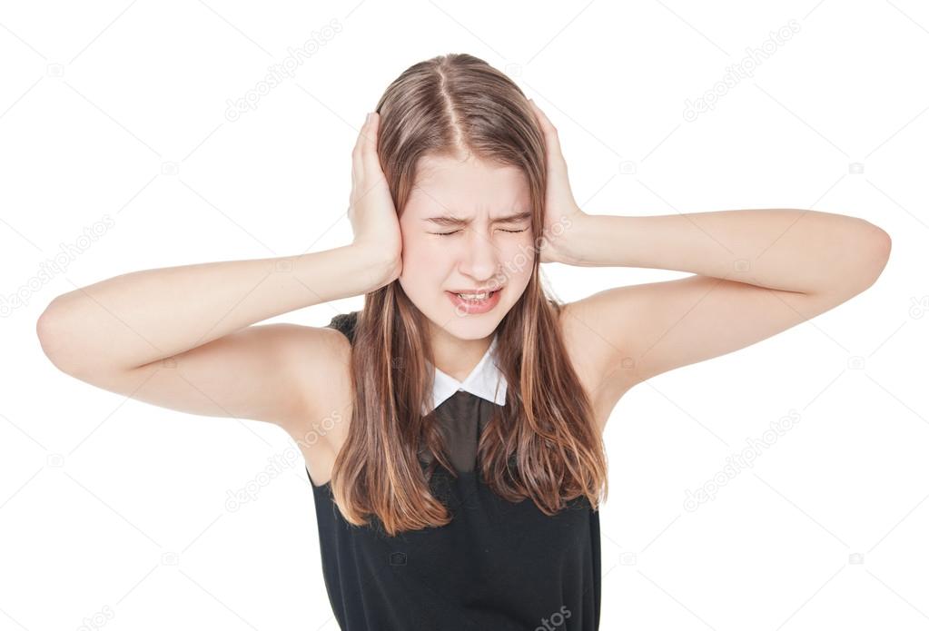 Young teenager girl covering ears with her hands isolated Stock Photo