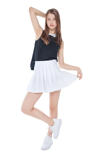 Joven chica de moda en falda blanca posando aislada —  Fotos de Stock