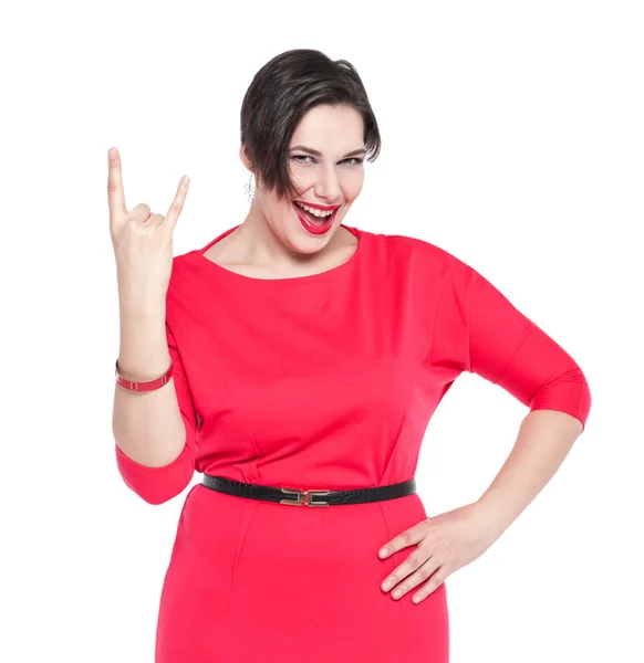 Beautiful plus size woman in red dress with horn gesture isolate — Stock Photo, Image