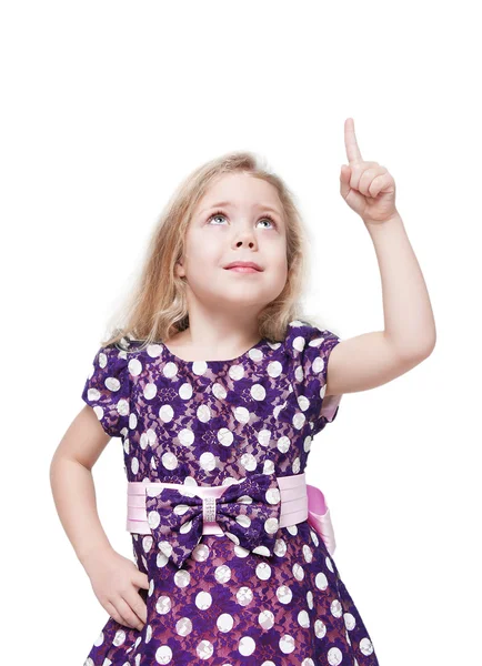 Beautiful little girl showing on something by finger isolated — Stock Photo, Image