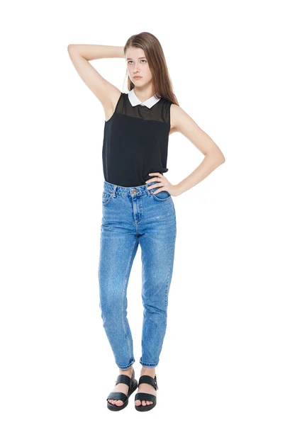 Young fashion girl in jeans posing isolated — Stock Photo, Image