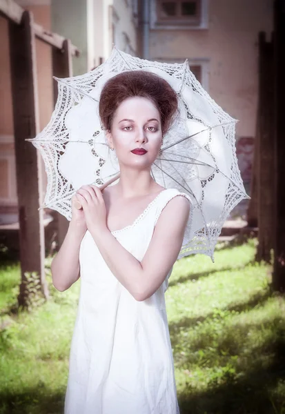Beautiful young gothic woman in white shirt with umbrella — Stock Photo, Image