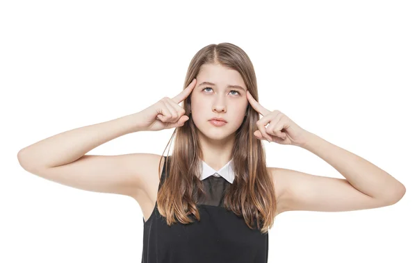 Young teenage girl pressed her fingers to the temple isolated — Stock Photo, Image