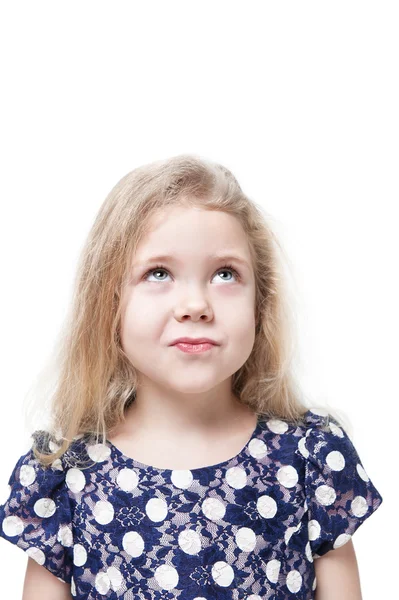 Beautiful little girl skeptically looking on something isolated — Stock Photo, Image