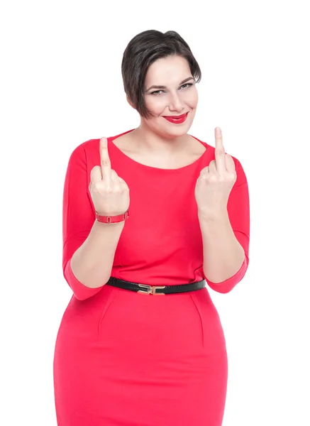 Beautiful plus size woman in red dress showing middle fingers is — Stock Photo, Image