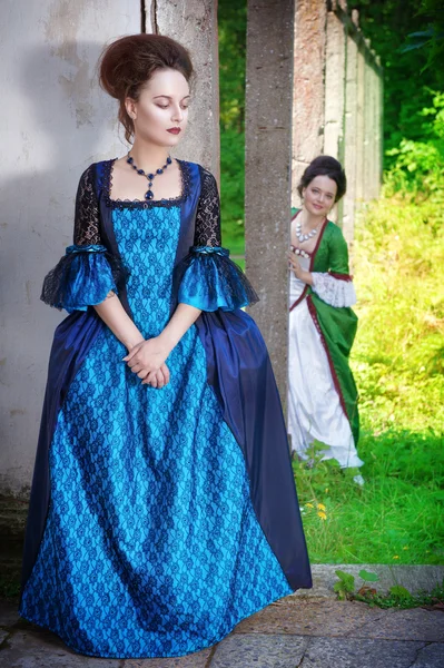 Two young beautiful women in long medieval dresses — Stock Photo, Image