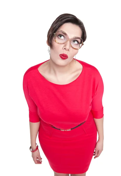 Thoughtful beautiful plus size woman in glasses looking on somet — Stock Photo, Image