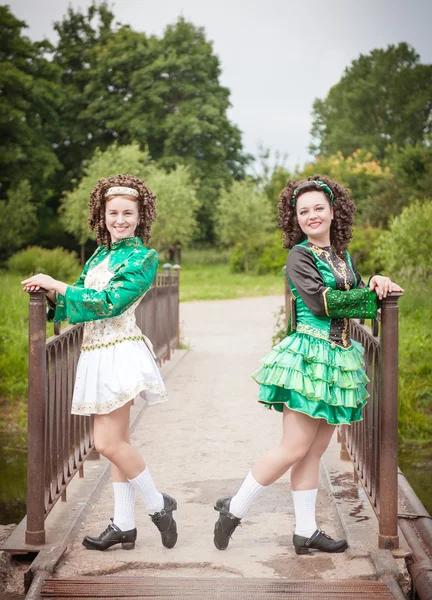 Two young beautiful girl in irish dance dress posing outdoor — Stock Photo, Image