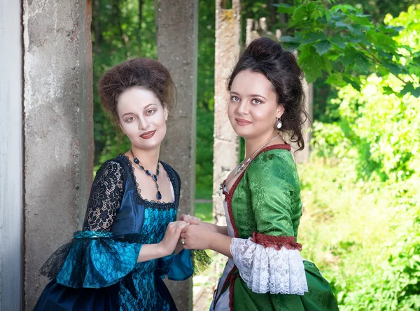 Two young beautiful women in long medieval dresses — Stock Photo, Image