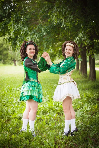Two young beautiful girl in irish dance dress posing outdoor — Stock Photo, Image