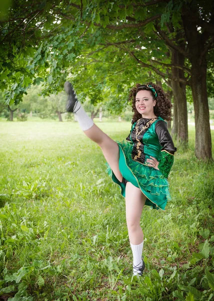 Young beautiful girl in irish dance dress dancing outdoor — Stock Photo, Image