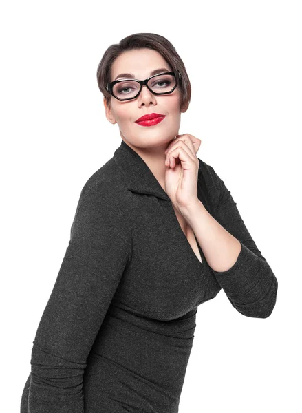 Beautiful plus size woman in black dress and glasses posing isol — Stock Photo, Image