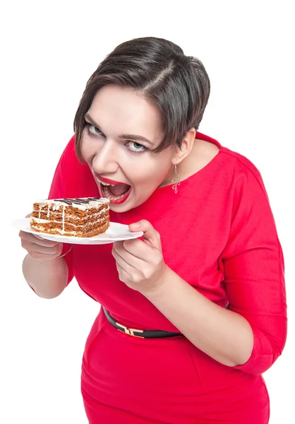 Beautiful plus size woman eating cake — Stock Photo, Image