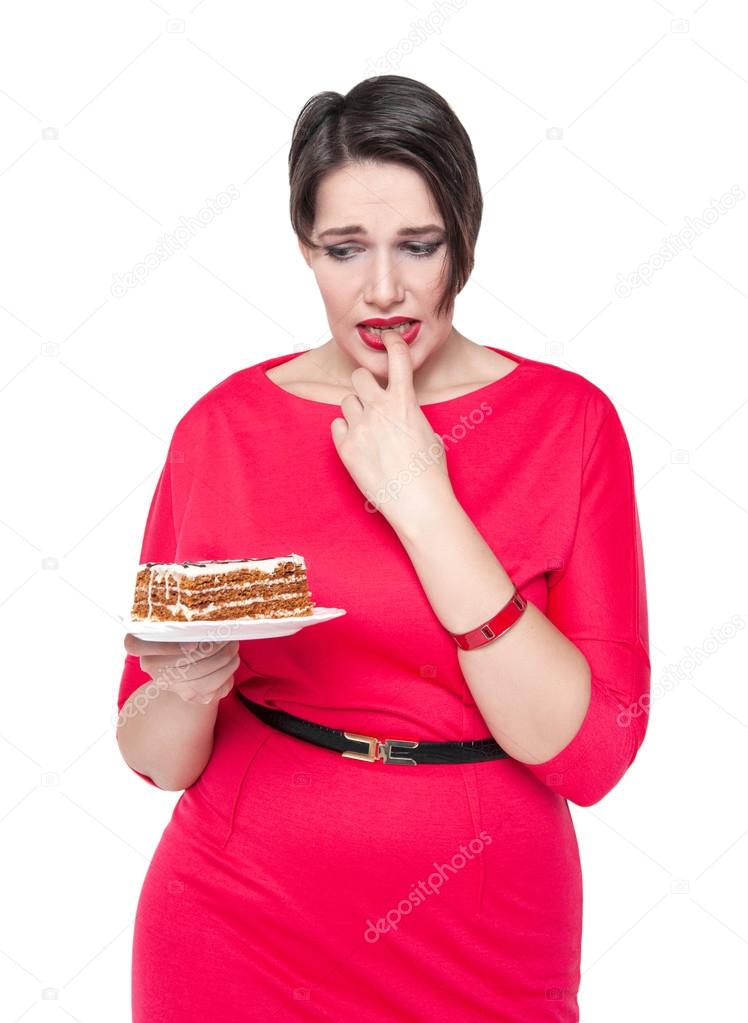 Beautiful plus size woman temptating with cake 