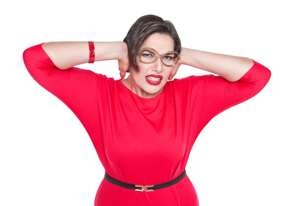 Beautiful plus size woman in glasses covering her ears with her — Stock Photo, Image