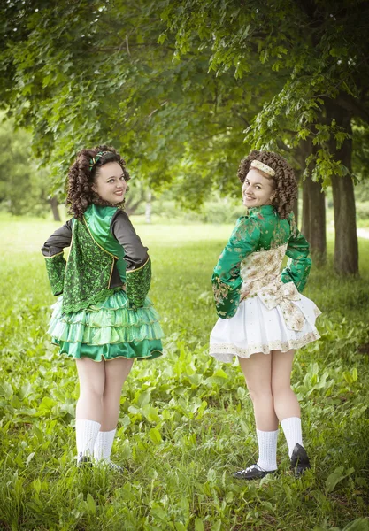 Two young beautiful girl in irish dance dress posing outdoor — Stock Photo, Image