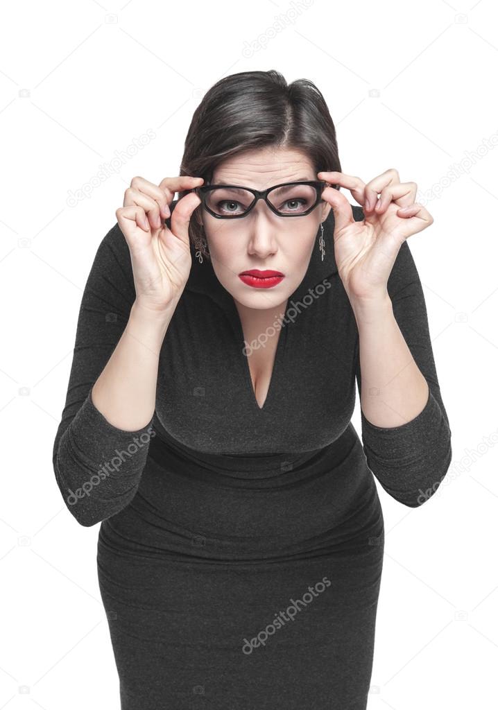 Plus size woman in glasses looking on you isolated 