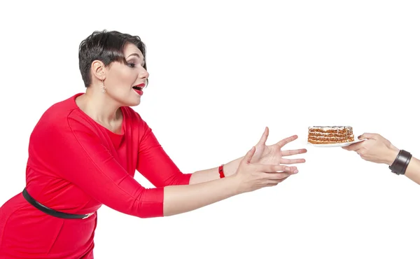 Beautiful plus size woman temptating with cake — Stock Photo, Image