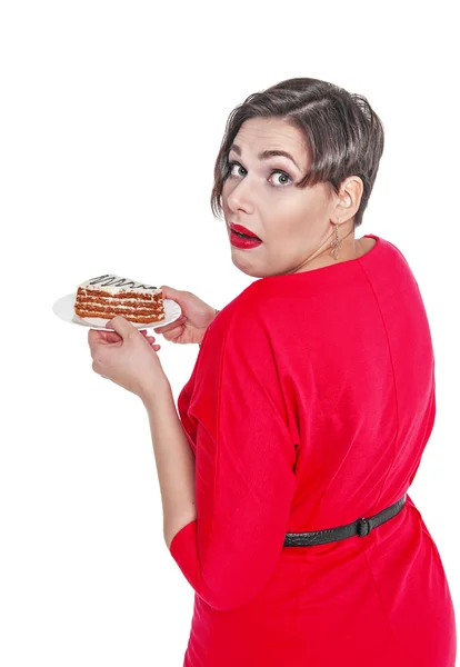 Beautiful plus size woman eating cake isolated — Stock Photo, Image