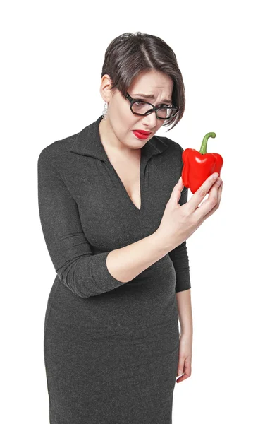Plus size woman sadly looking on red pepper isolated — Stock Photo, Image