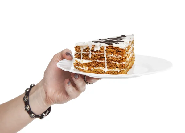 Mano tenendo pezzo di torta isolato — Foto Stock